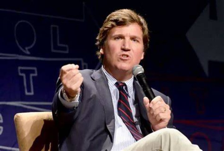 Watch Tucker Carlson's face when he finds out how many gay